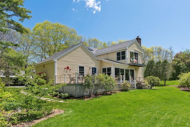 401 Princes Point Rd, Yarmouth, ME 04096 - back of property with a chimney, a yard, a balcony, and a shingled roof