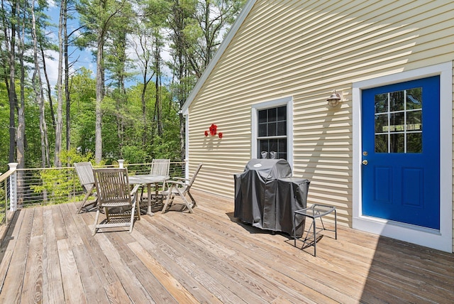 401 Princes Point Rd, Yarmouth, ME 04096 - wooden deck with outdoor dining area and a grill