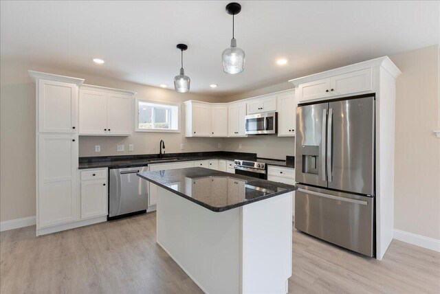 12 Casey Ln, Old Orchard Beach, ME 04064 - kitchen featuring appliances with stainless steel finishes, a sink, baseboards, white cabinets, and light wood-style floors