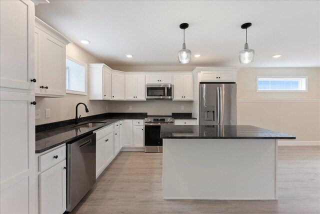 12 Casey Ln, Old Orchard Beach, ME 04064 - kitchen with appliances with stainless steel finishes, a sink, white cabinetry, light wood-style floors, and recessed lighting