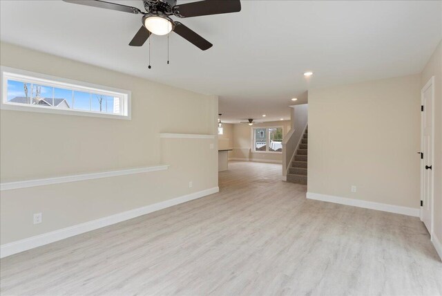 12 Casey Ln, Old Orchard Beach, ME 04064 - empty room featuring a ceiling fan, light wood finished floors, stairway, baseboards, and recessed lighting