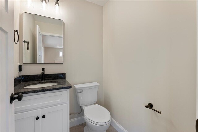 12 Casey Ln, Old Orchard Beach, ME 04064 - half bath with toilet, vanity, and baseboards