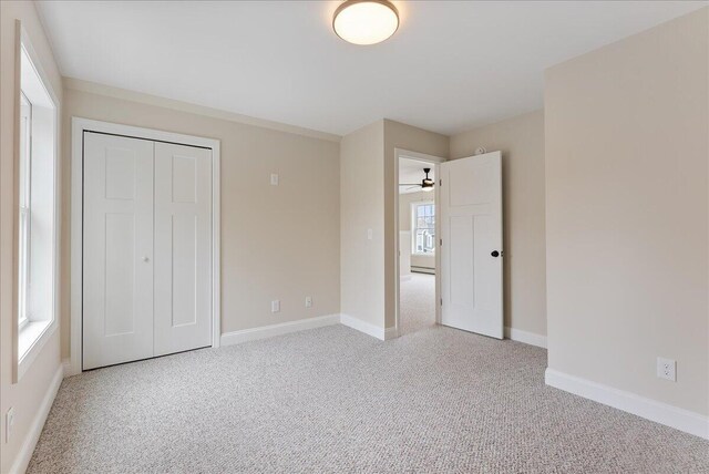12 Casey Ln, Old Orchard Beach, ME 04064 - unfurnished bedroom featuring light colored carpet, baseboards, and a closet