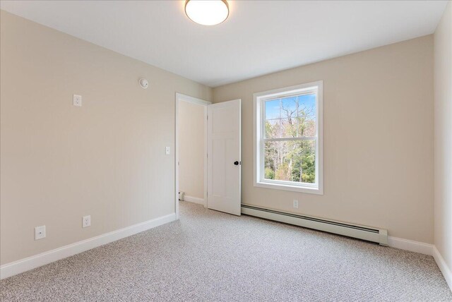12 Casey Ln, Old Orchard Beach, ME 04064 - unfurnished room with baseboard heating, light colored carpet, and baseboards