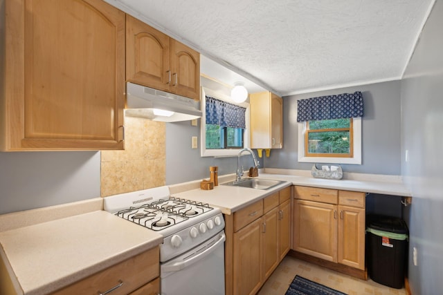 29 Island Pond Rd, Leeds, ME 04263 - kitchen with white range with gas stovetop, under cabinet range hood, a sink, a textured ceiling, and light countertops