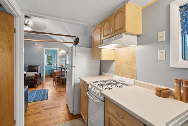 29 Island Pond Rd, Leeds, ME 04263 - kitchen with white range with gas cooktop, under cabinet range hood, light wood-type flooring, ceiling fan, and light countertops