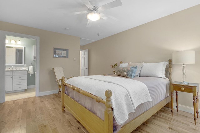 65 Pine Point Rd Unit 12, Scarborough, ME 04074 - bedroom with light wood-style flooring, a sink, baseboards, and ceiling fan