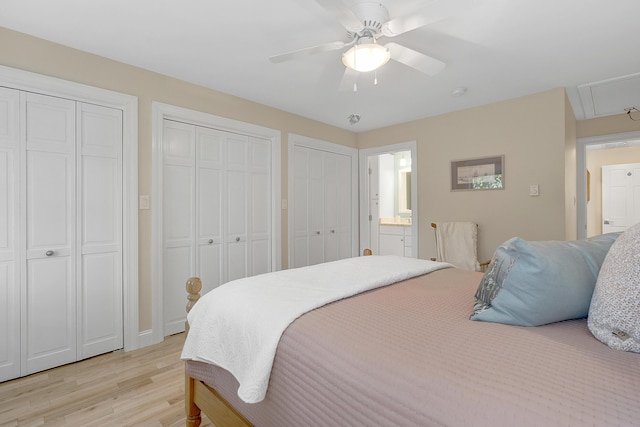 65 Pine Point Rd Unit 12, Scarborough, ME 04074 - bedroom with light wood-style flooring, two closets, attic access, a ceiling fan, and ensuite bathroom