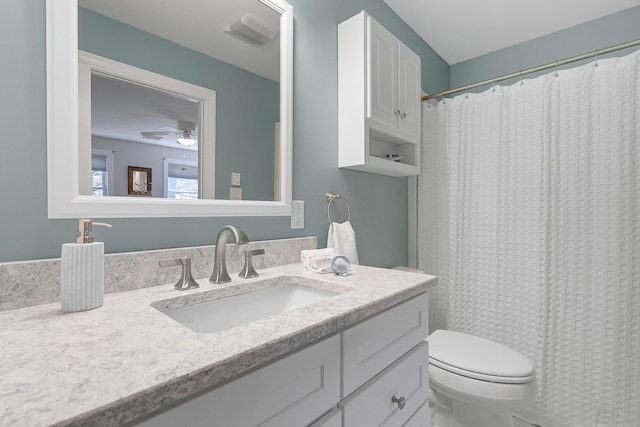 65 Pine Point Rd Unit 12, Scarborough, ME 04074 - full bath featuring vanity, toilet, curtained shower, and a ceiling fan