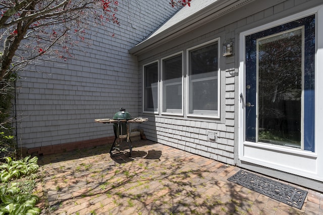 65 Pine Point Rd Unit 12, Scarborough, ME 04074 - view of home's exterior featuring a patio area