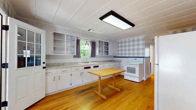 118 Riverside Dr, Auburn, ME 04210 - kitchen featuring white appliances, a sink, open shelves, light wood-style flooring, and white cabinetry