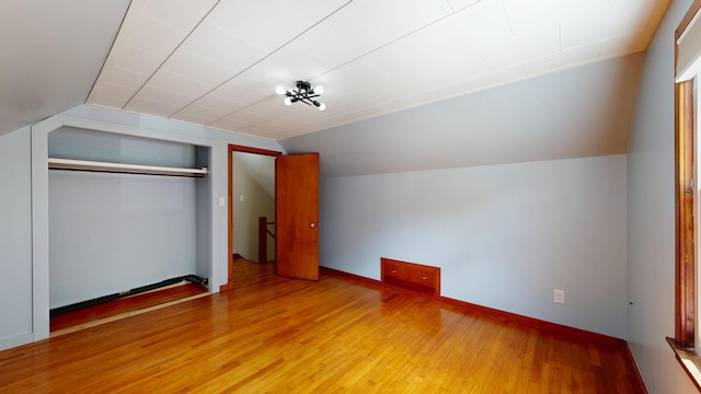 118 Riverside Dr, Auburn, ME 04210 - unfurnished bedroom with lofted ceiling, light wood finished floors, and a closet