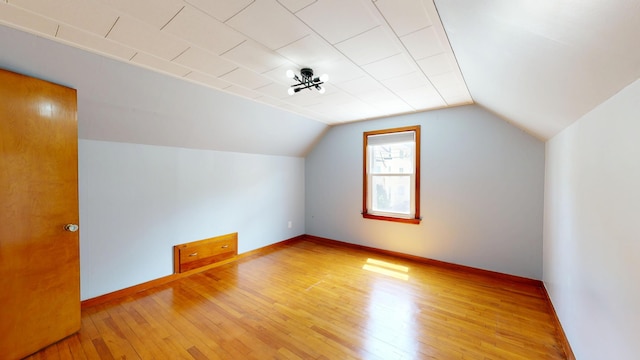 118 Riverside Dr, Auburn, ME 04210 - additional living space featuring light wood-style flooring, baseboards, and lofted ceiling