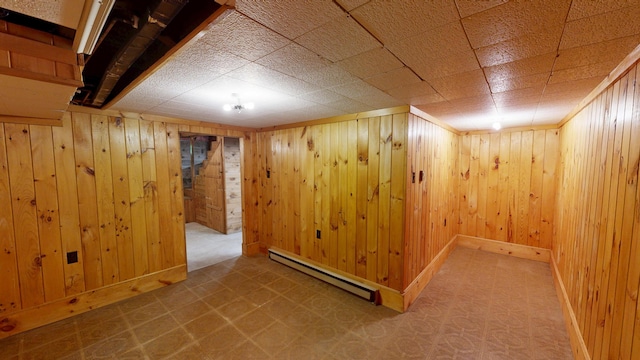 118 Riverside Dr, Auburn, ME 04210 - finished basement with baseboard heating, wooden walls, and baseboards