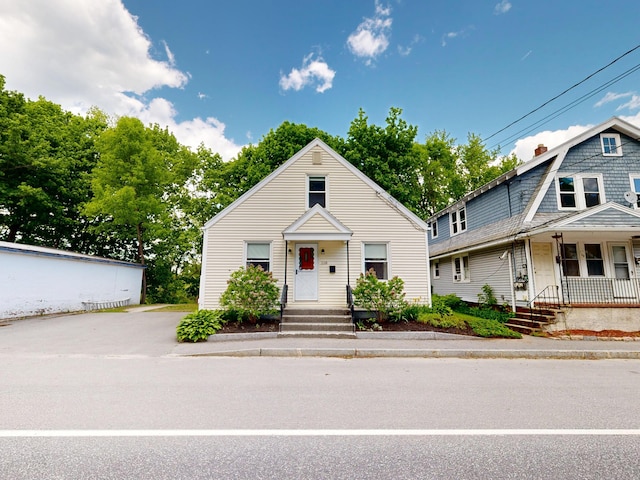 118 Riverside Dr, Auburn, ME 04210 - view of front facade featuring a porch and a chimney