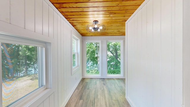 118 Riverside Dr, Auburn, ME 04210 - unfurnished sunroom featuring a chandelier