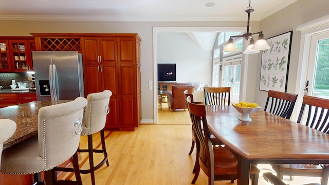 67 Joans Hill Rd, Bangor, ME 04401 - dining area featuring light wood-style floors, crown molding, and a ceiling fan