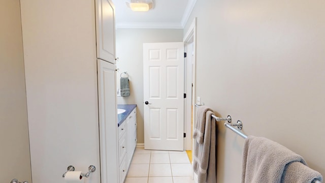 67 Joans Hill Rd, Bangor, ME 04401 - laundry room featuring crown molding and light tile patterned flooring