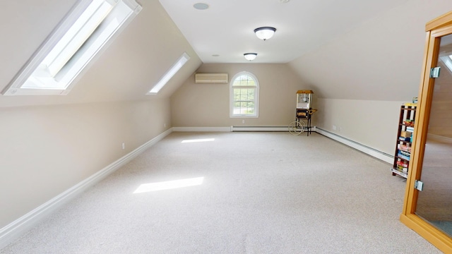 67 Joans Hill Rd, Bangor, ME 04401 - additional living space with a wall unit AC, vaulted ceiling, a skylight, carpet flooring, and baseboards