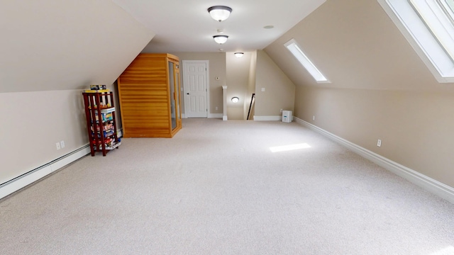 67 Joans Hill Rd, Bangor, ME 04401 - bonus room featuring vaulted ceiling, a skylight, carpet, baseboards, and a baseboard radiator
