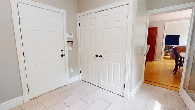 67 Joans Hill Rd, Bangor, ME 04401 - entryway with baseboards and light wood finished floors
