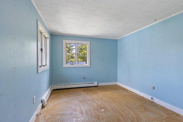 95 Riverview Dr, Gardiner, ME 04345 - spare room featuring a baseboard heating unit and baseboards