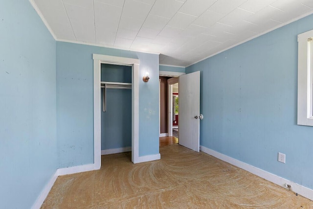 95 Riverview Dr, Gardiner, ME 04345 - unfurnished bedroom with a closet, baseboards, and ornamental molding