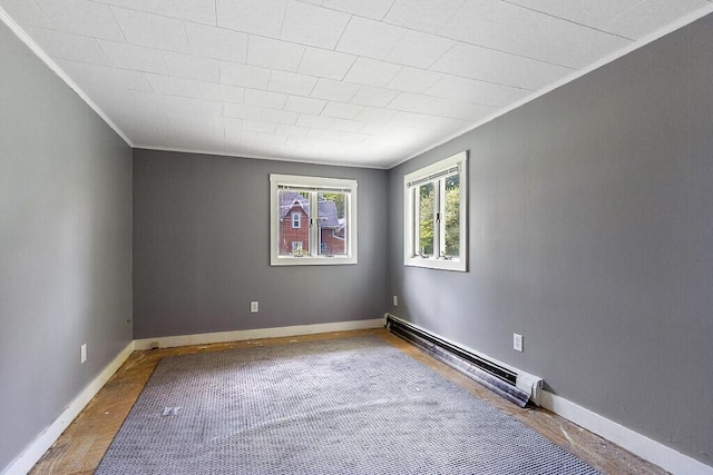 95 Riverview Dr, Gardiner, ME 04345 - spare room with baseboard heating, ornamental molding, and baseboards