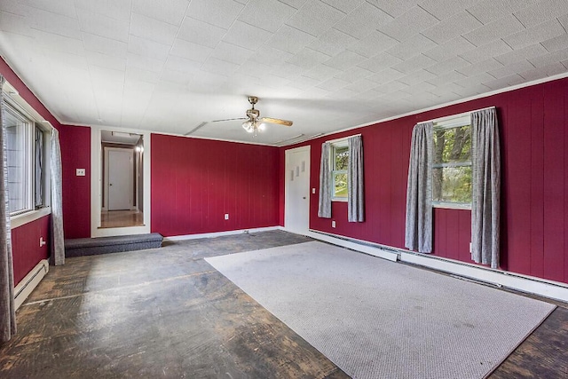 95 Riverview Dr, Gardiner, ME 04345 - empty room with a baseboard heating unit, a ceiling fan, concrete flooring, and attic access