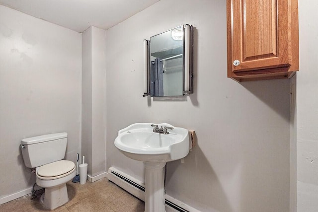 95 Riverview Dr, Gardiner, ME 04345 - bathroom with toilet, baseboards, and a baseboard heating unit