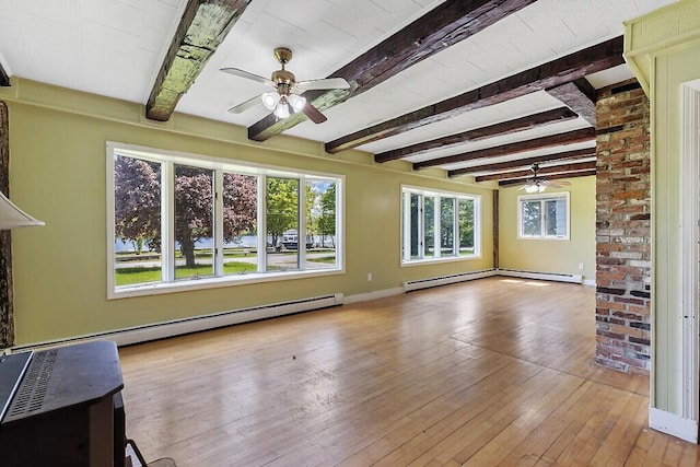 95 Riverview Dr, Gardiner, ME 04345 - unfurnished living room featuring ceiling fan, beam ceiling, a baseboard heating unit, hardwood / wood-style floors, and baseboards