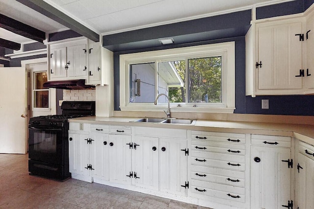 95 Riverview Dr, Gardiner, ME 04345 - kitchen featuring black gas range, under cabinet range hood, a sink, and white cabinetry