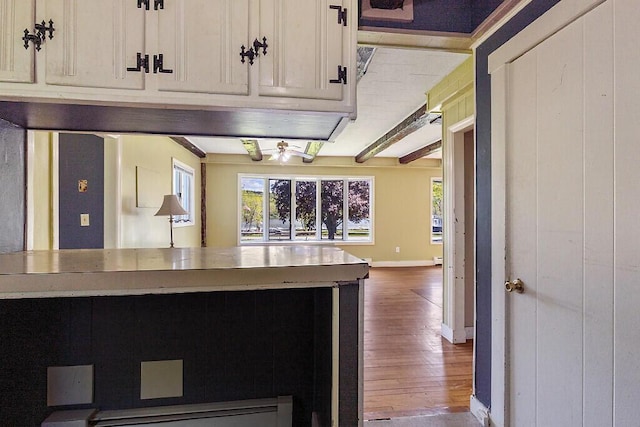 95 Riverview Dr, Gardiner, ME 04345 - kitchen with wood finished floors, a baseboard radiator, and baseboards