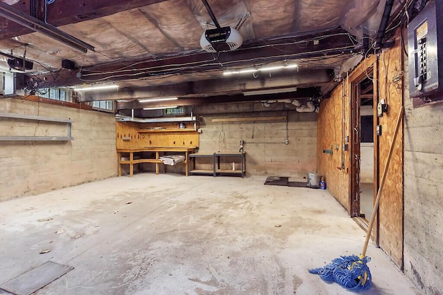 95 Riverview Dr, Gardiner, ME 04345 - garage featuring a garage door opener and electric panel