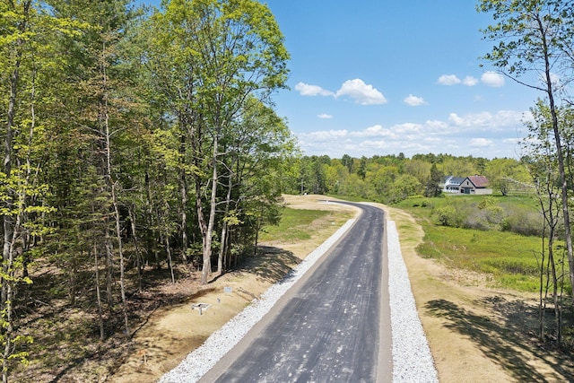 11 Coastal Pnes, Cumberland, ME 04021 - view of asphalt street featuring a forest view
