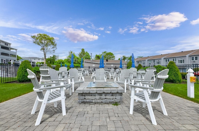 1801 Post Rd Unit 144, Wells, ME 04090 - view of patio / terrace with an outdoor fire pit and a residential view