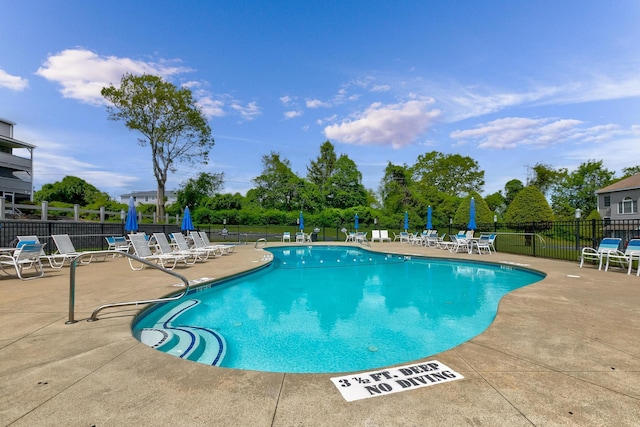 1801 Post Rd Unit 144, Wells, ME 04090 - community pool featuring a patio