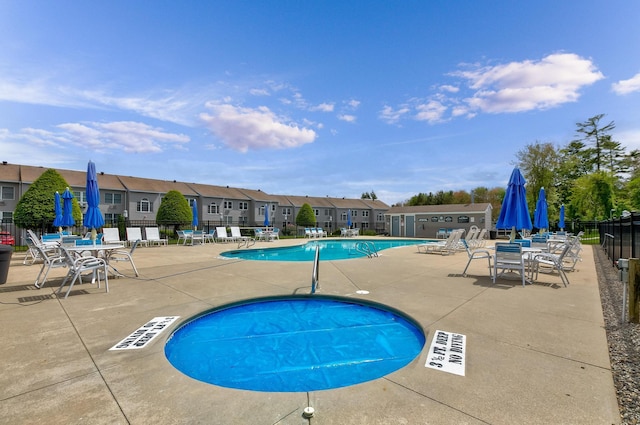 1801 Post Rd Unit 144, Wells, ME 04090 - community pool featuring a patio area and a residential view