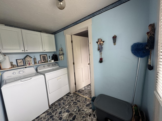41 S Main St, Guilford, ME 04443 - laundry room featuring cabinet space, independent washer and dryer, dark stone finish floors, and a textured ceiling