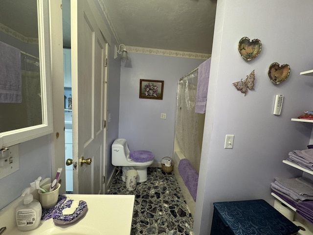 41 S Main St, Guilford, ME 04443 - full bath with toilet, shower / tub combo, vanity, and baseboards