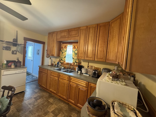 41 S Main St, Guilford, ME 04443 - kitchen with a sink, stone finish flooring, brown cabinetry, and ceiling fan