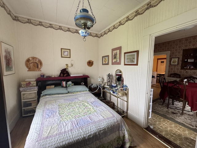 41 S Main St, Guilford, ME 04443 - bedroom featuring wood finished floors and wallpapered walls