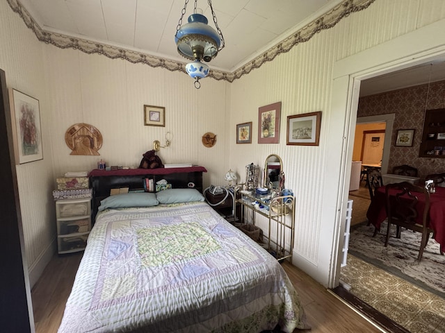 41 S Main St, Guilford, ME 04443 - bedroom featuring wood finished floors and wallpapered walls