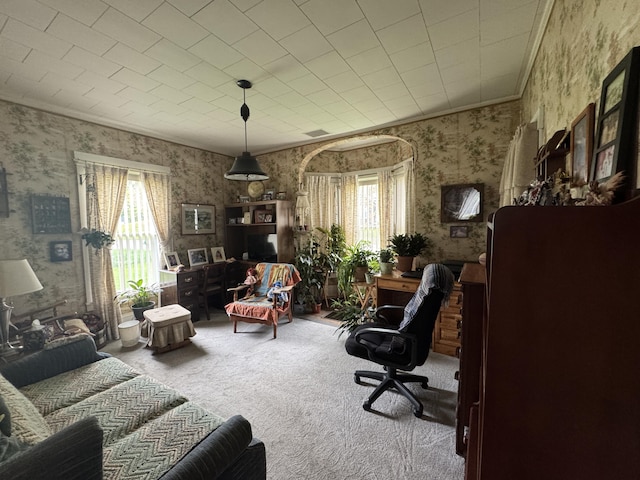 41 S Main St, Guilford, ME 04443 - living room with wallpapered walls, healthy amount of natural light, carpet, and an office area