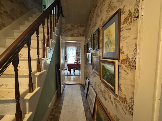 41 S Main St, Guilford, ME 04443 - hall featuring wallpapered walls, baseboards, and stairway