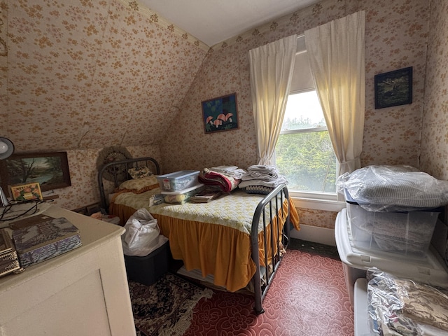 41 S Main St, Guilford, ME 04443 - carpeted bedroom with wallpapered walls and vaulted ceiling