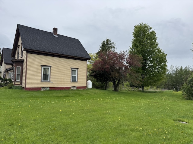 41 S Main St, Guilford, ME 04443 - view of side of home with a chimney, a yard, and a shingled roof