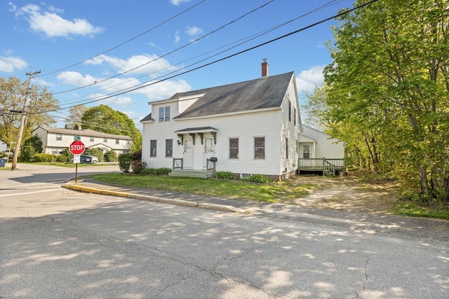 1 Fall St, Biddeford, ME 04005 - view of front of home featuring a chimney, roof with shingles, and uncovered parking