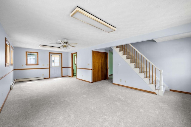 1 Fall St, Biddeford, ME 04005 - unfurnished living room with a baseboard radiator, stairs, carpet floors, baseboards, and ceiling fan