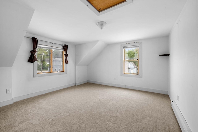 1 Fall St, Biddeford, ME 04005 - bonus room featuring baseboard heating, carpet flooring, baseboards, and lofted ceiling